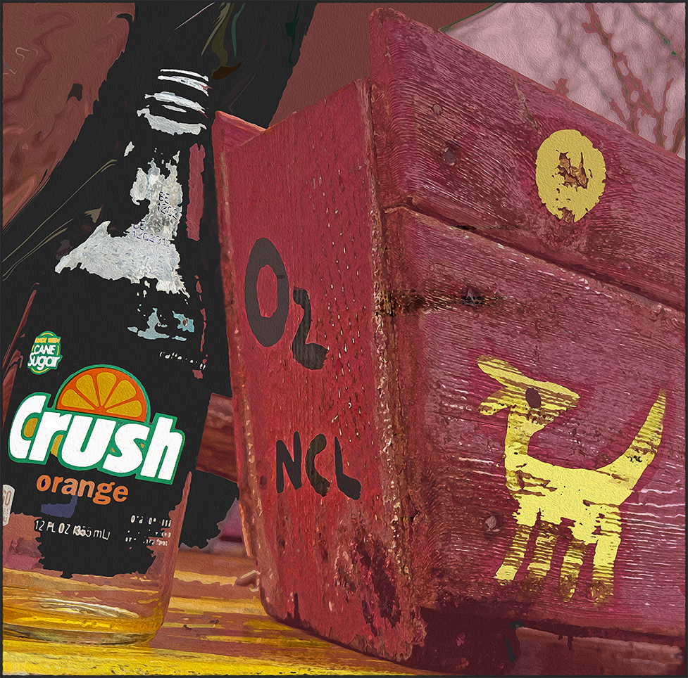 a bottle of Orange Crush next to a wooden box with cryptic code and an archetype at 3 Dog Acres and Corvus Studio in the Ozark Highlands of Arkansas on 24 March 2024